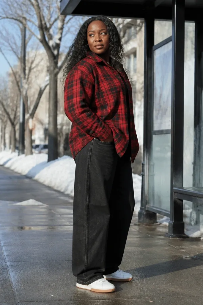 Red plaid flannel with oversized black jeans and white sneakers
