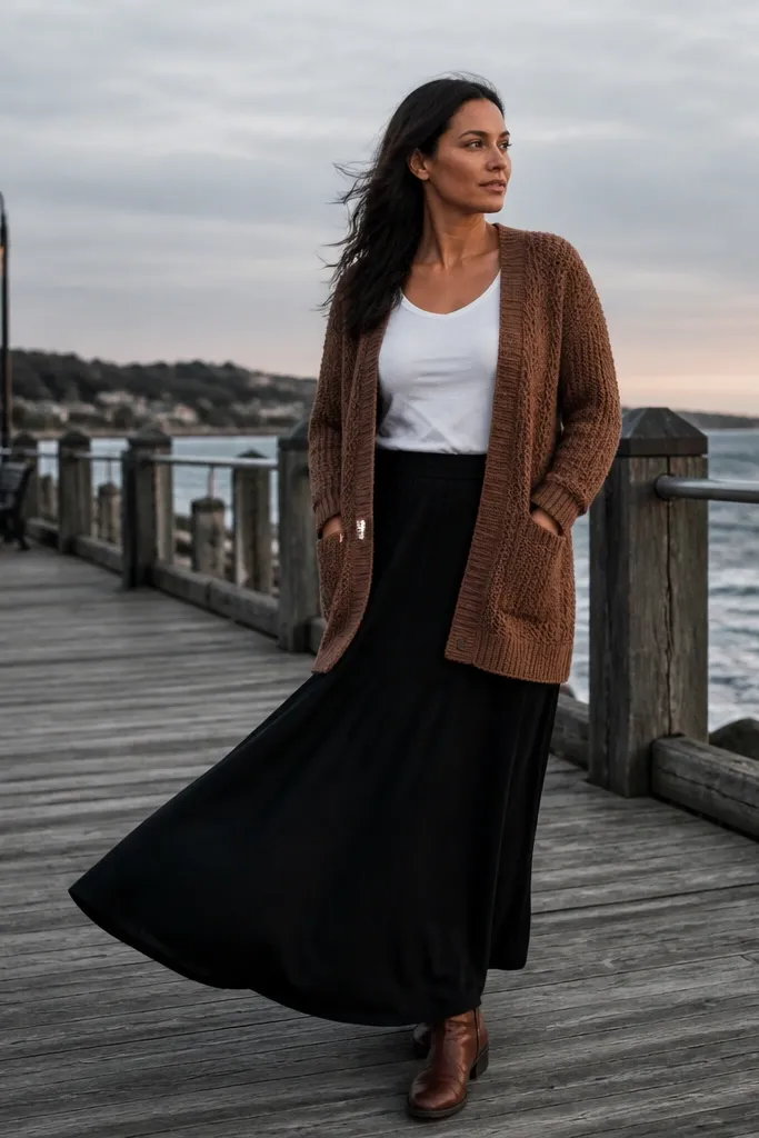Brown knitted cardigan over white tee with a black maxi skirt and brown sandals