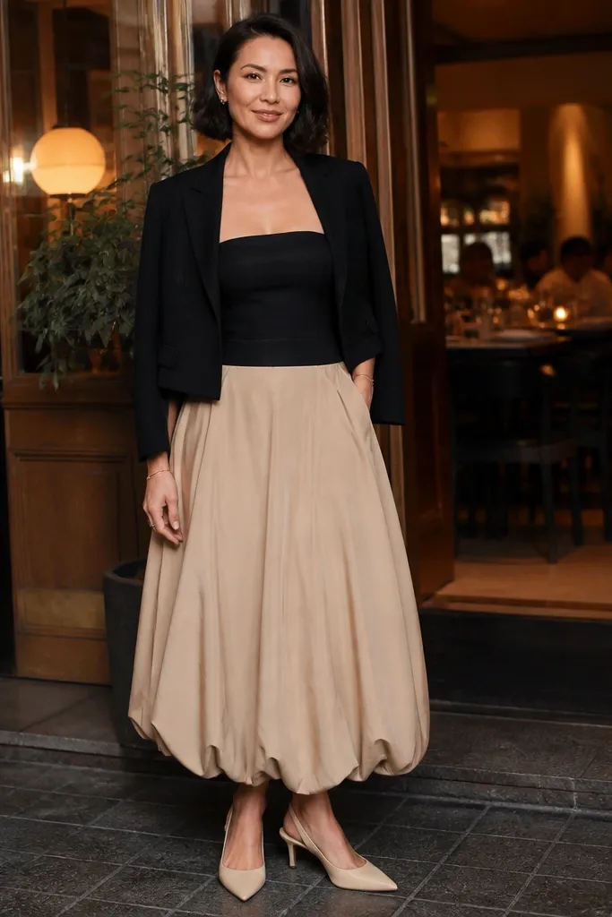 Nude bubble maxi skirt with a black strapless bodysuit and cropped blazer