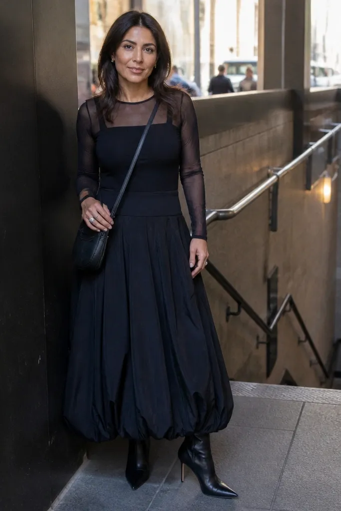 Long sleeve mesh top over a fitted base with a black maxi bubble skirt