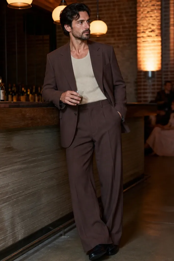 Sand ribbed tank with mocha wide-leg suit pants and brown loafers