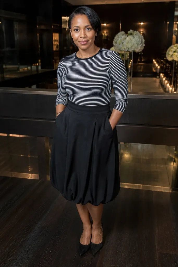 Black and white striped fitted top with a black bubble skirt and black heels