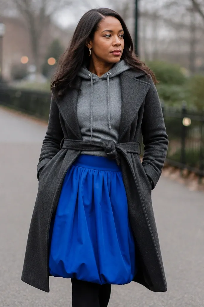 Cobalt bubble skirt with gray hoodie and long wool overcoat